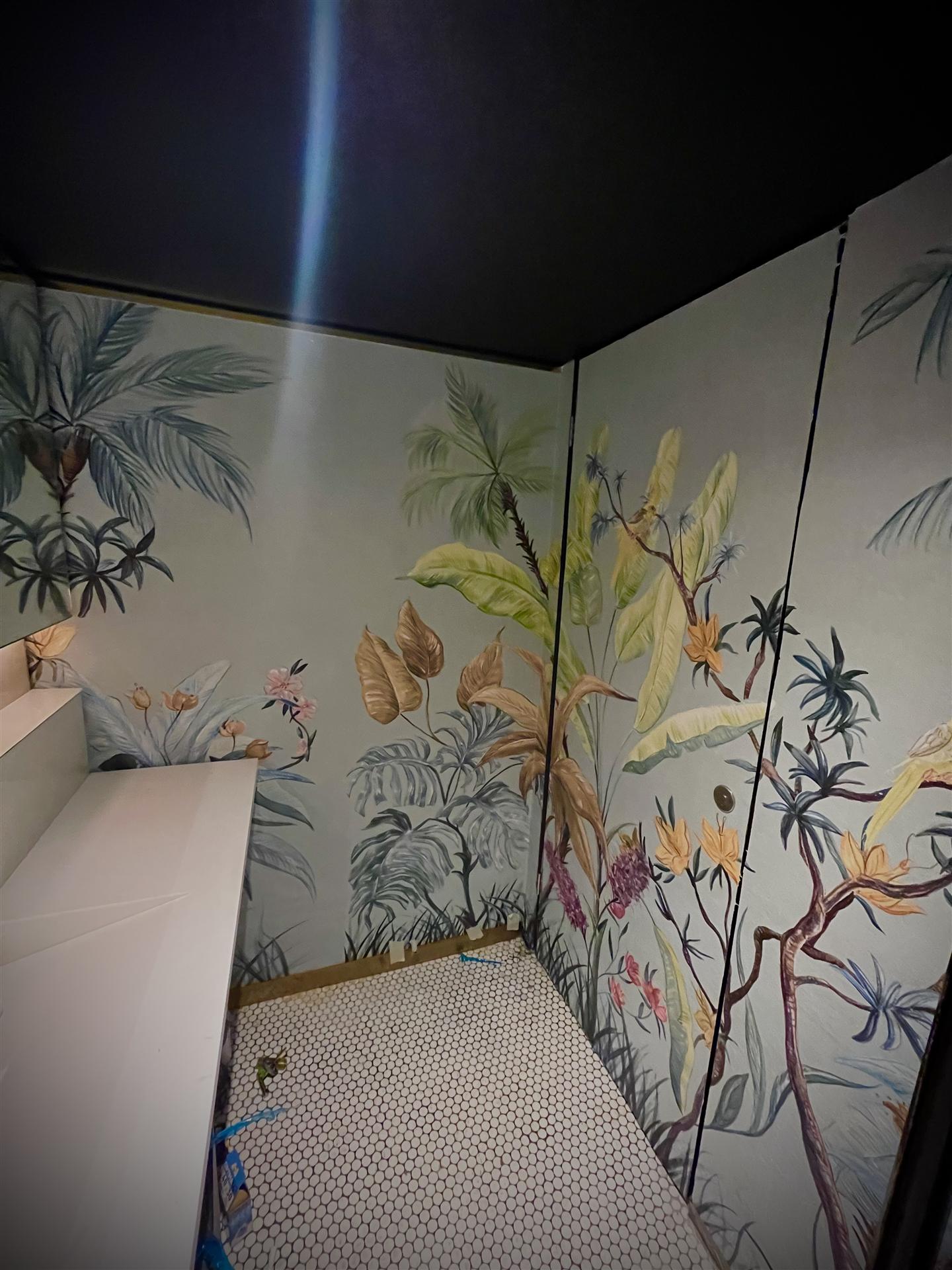 Tropical botanical wallpaper inside toilet cubicle, London